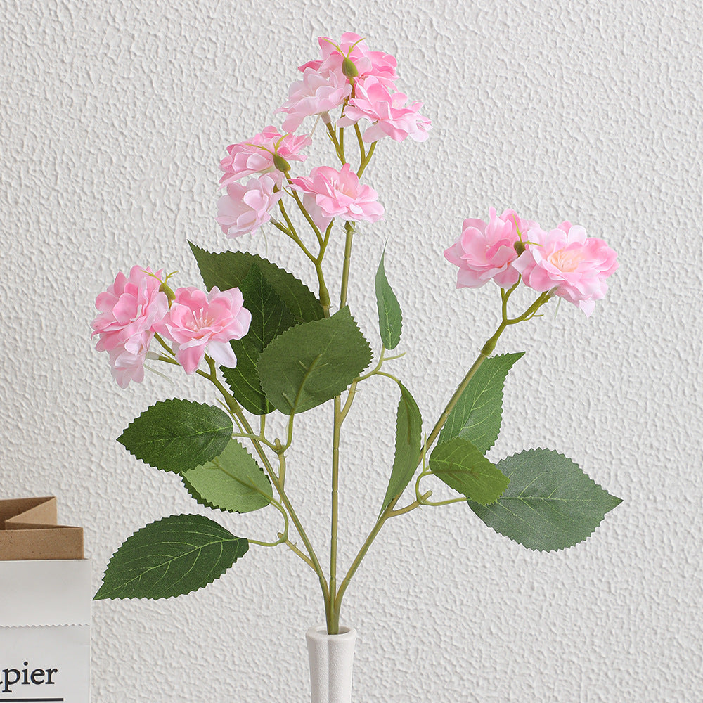 Artificial flower arrangement with delicate white blooms