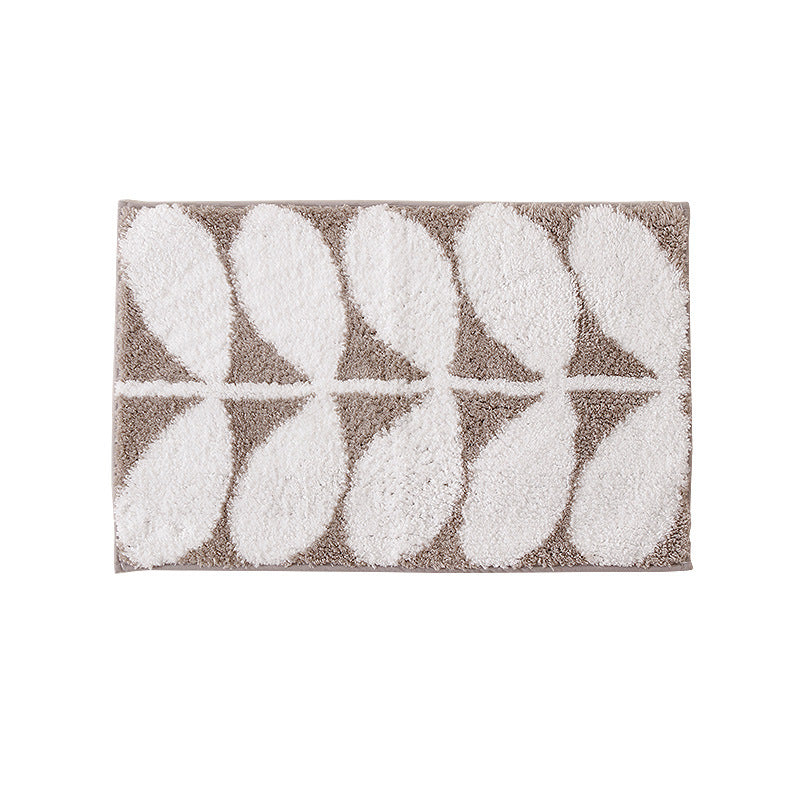 Fluffy bath mat in a graphic wave relief with anti-slip base