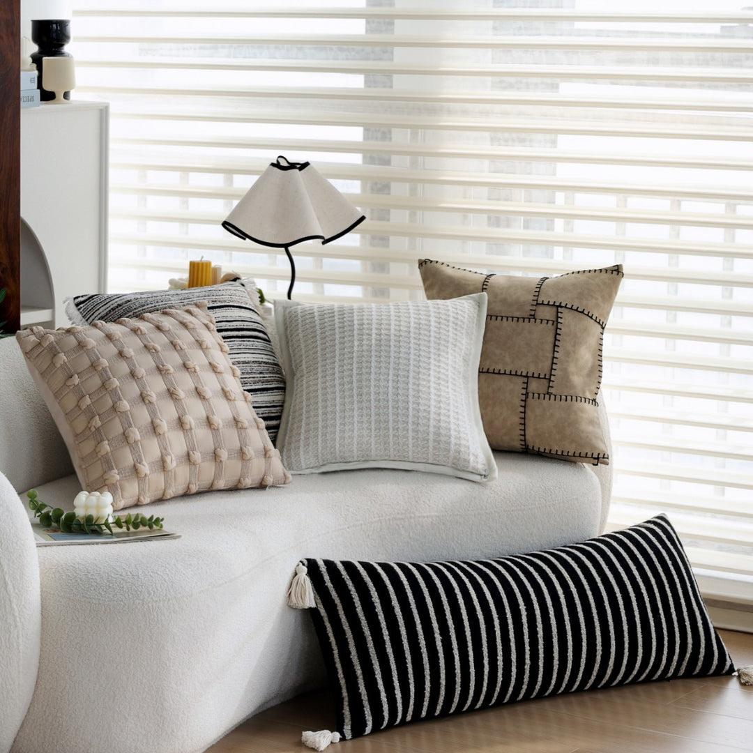 Woven home decor pillow cover with fine striped texture and hand-fringed edge