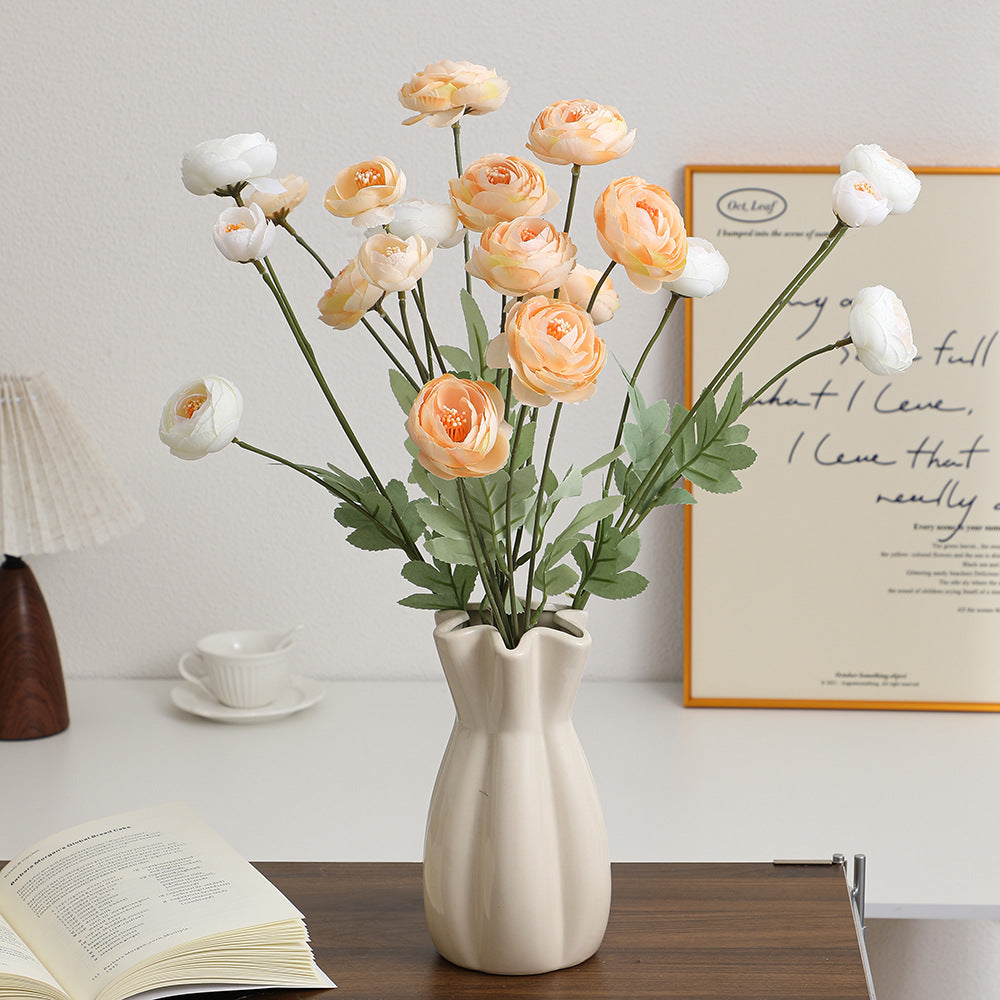 Decorative artificial flower bouquet with intricately detailed ranunculus