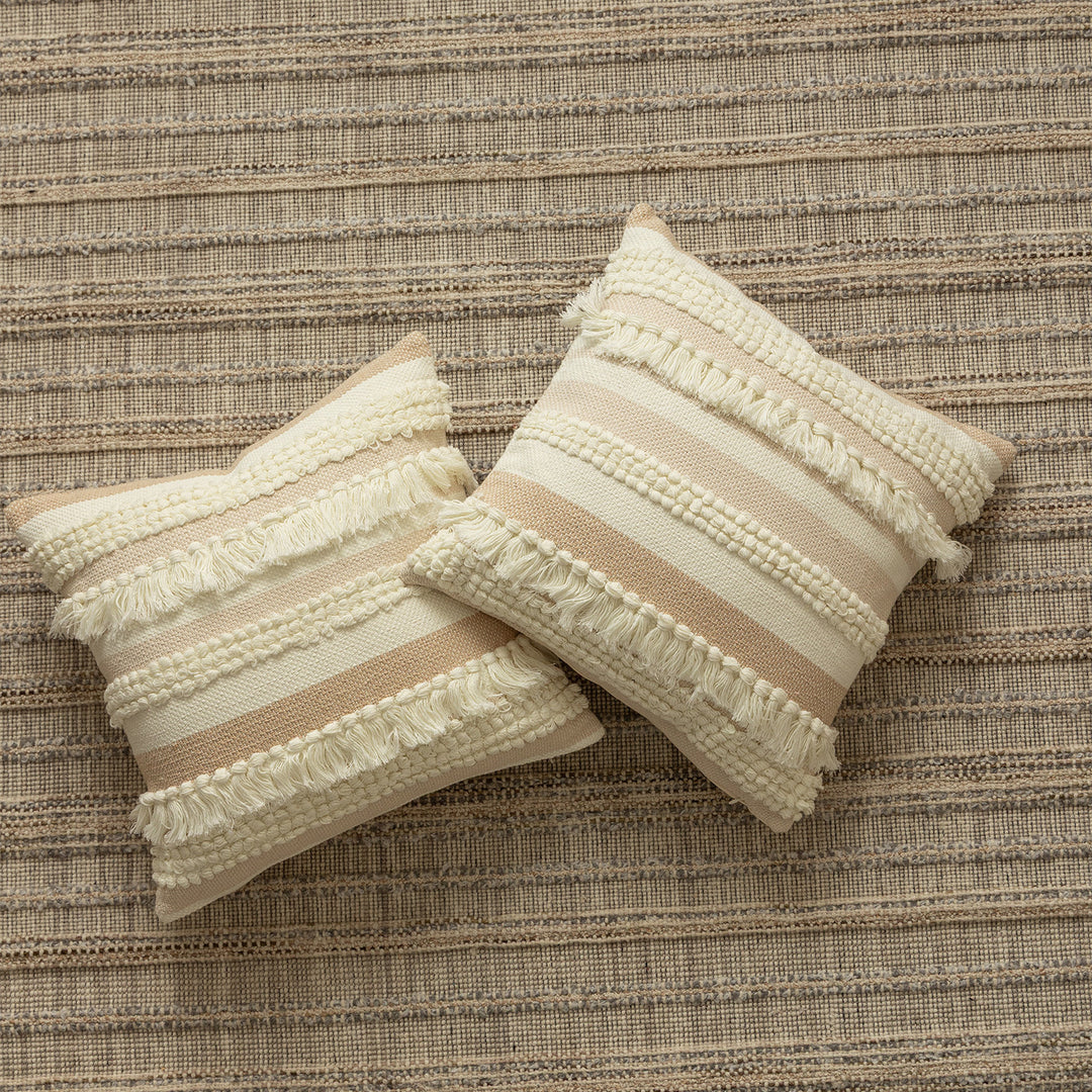 Decorative woven cushion cover with fringes and textured striped design