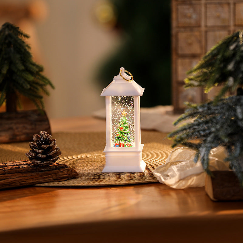 Illuminated Christmas lantern with glittering snowman scene