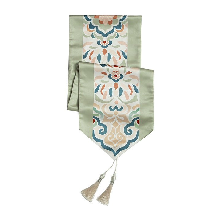 Handcrafted satin table runner with Oriental medallion pattern and decorative tassels