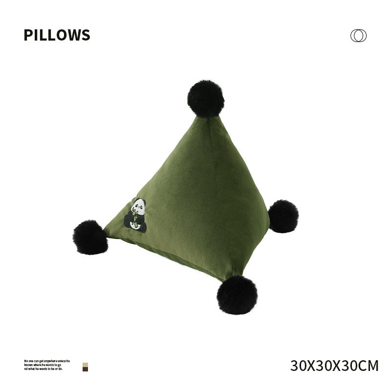 Pyramid-shaped triangle cushion with faux fur pom-poms and zebra embroidery