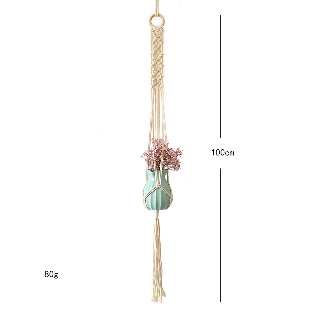 Macrame plant hanger with decorative tassels