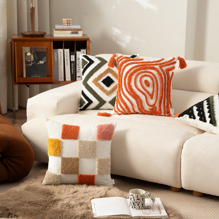 Decorative pillow with textured square appliqués and cotton cover