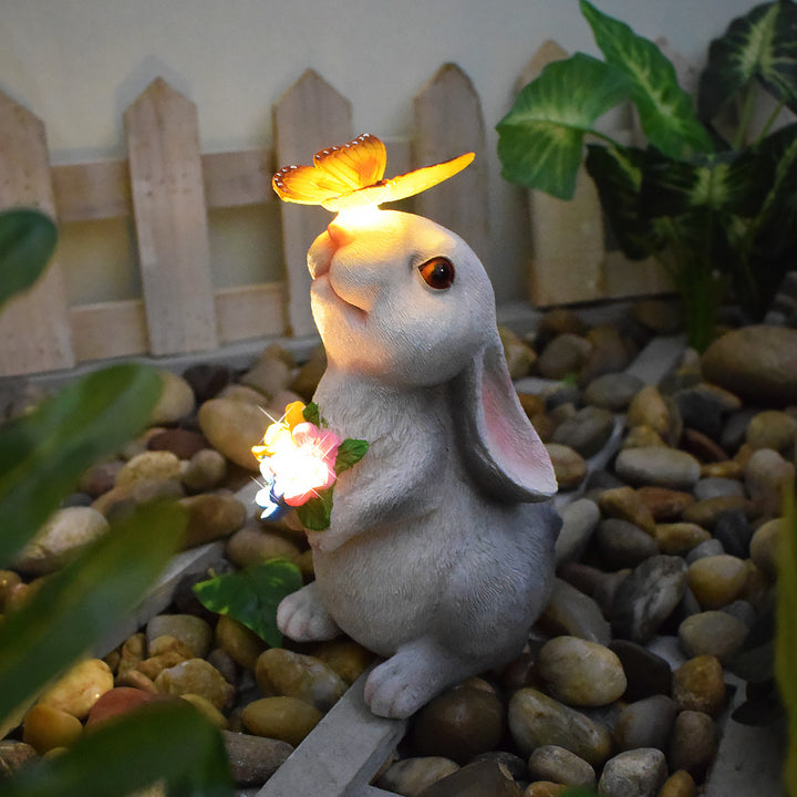 Solar-powered garden gnome sculpture with integrated LED fairy lights and turtle pot