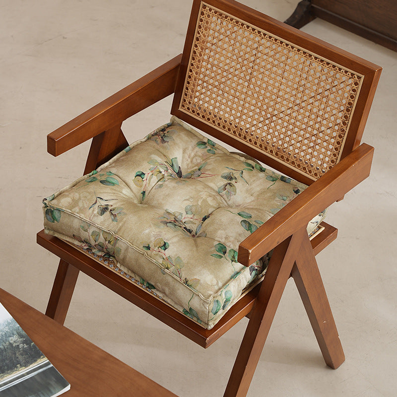 Padded square seat cushion with tufted stitching and fine bamboo print