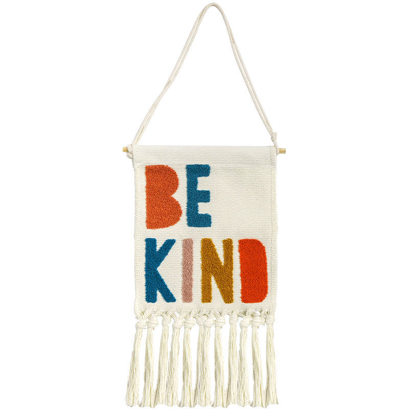 Boho wall hanging made of woven cotton with hand-tufted appliqués and fringes