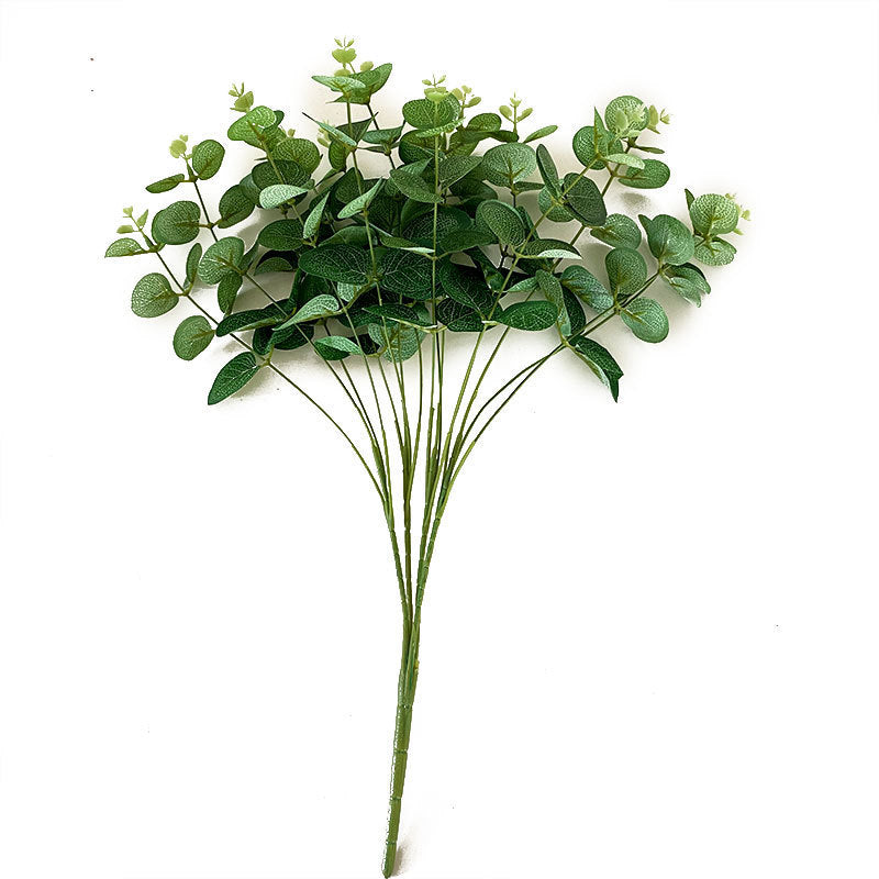 Artificial flowering branch with lifelike leaves and delicate flowers