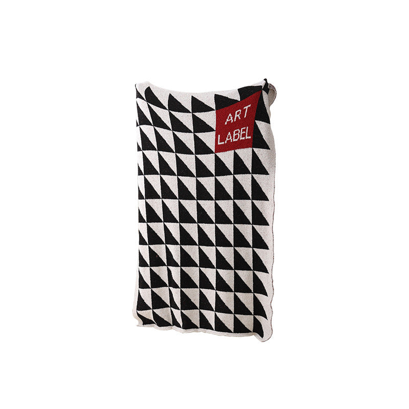 Coarsely woven decorative blanket with geometric jacquard pattern and soft bouclé