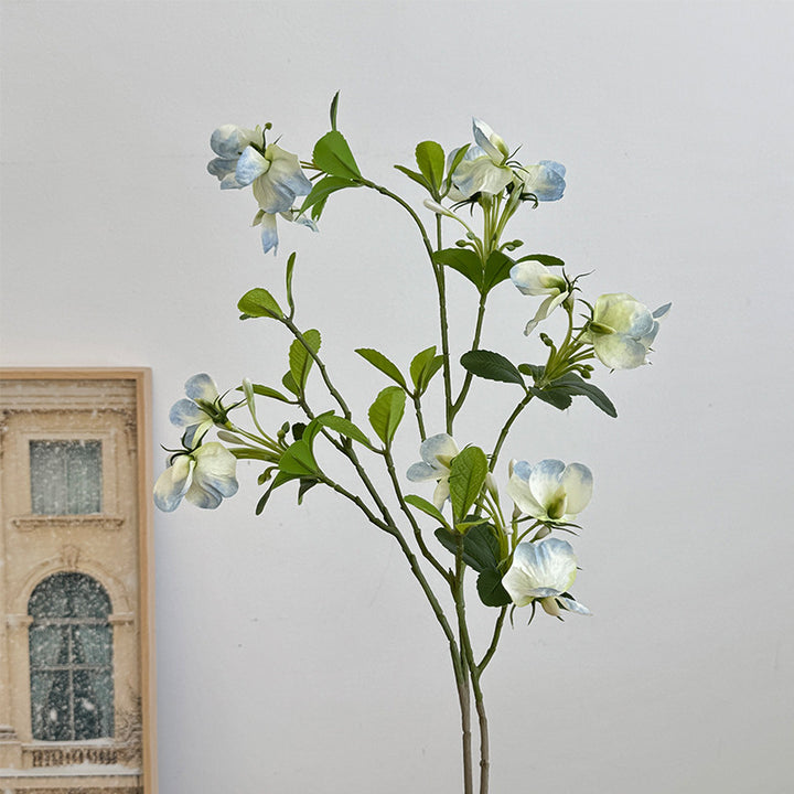 Artificial flower branch with vibrant pink flowers
