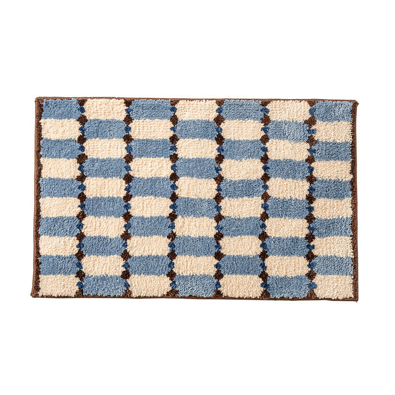Hand-tufted bathroom mat with a velvety pile, non-slip latex backing, and geometric honeycomb check pattern