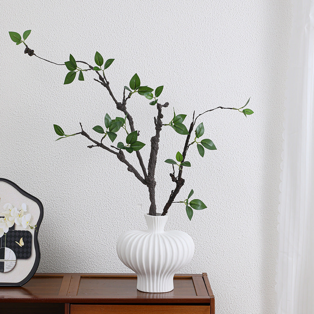Decorative artificial tree branch with realistic leaves