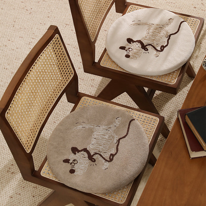 Round padded seat cushion with embroidered cat motif