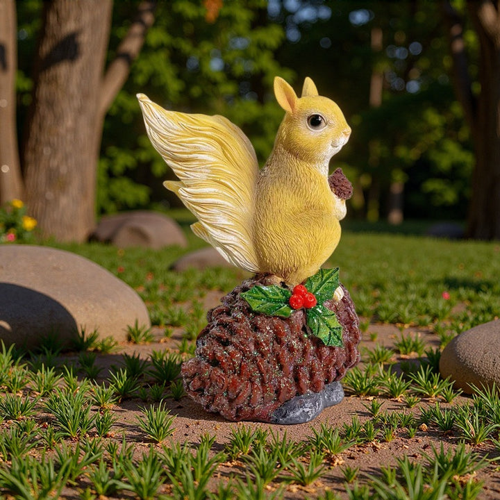 Decorative squirrel sculpture on a pine cone