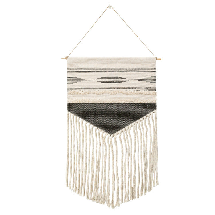 Woven wall hanging in Aztec style with cotton fringes and wooden rod