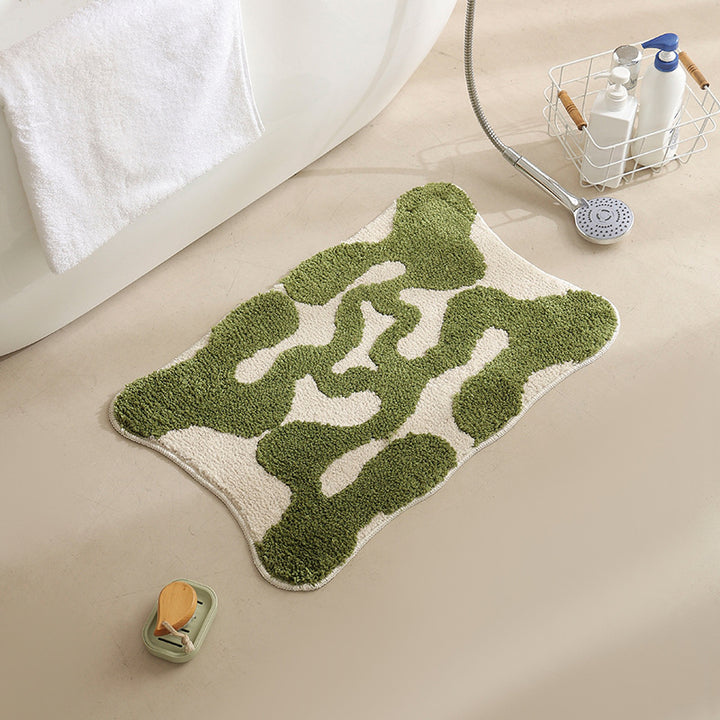 Hand-tufted bathroom bath mat with non-slip backing and textured square relief
