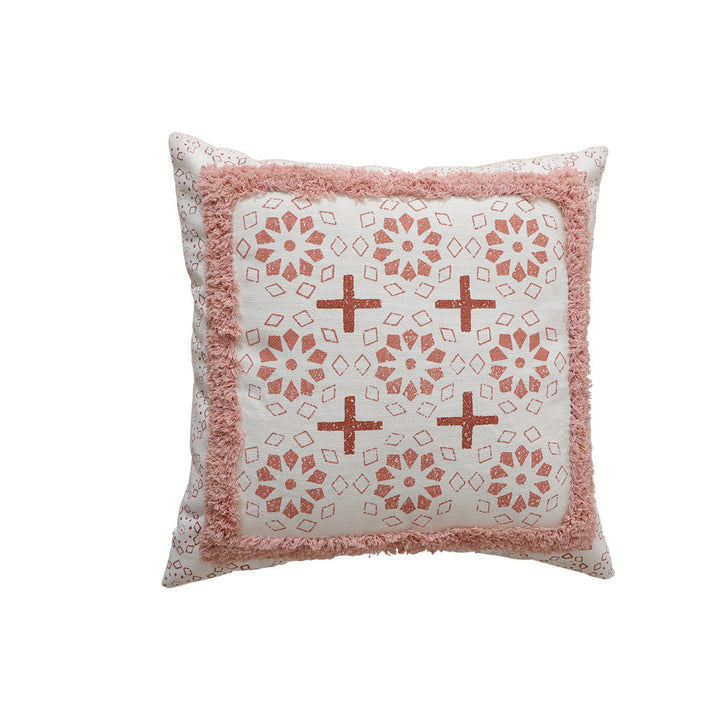 Woven decorative pillow with botanical jacquard pattern and pom-pom trim