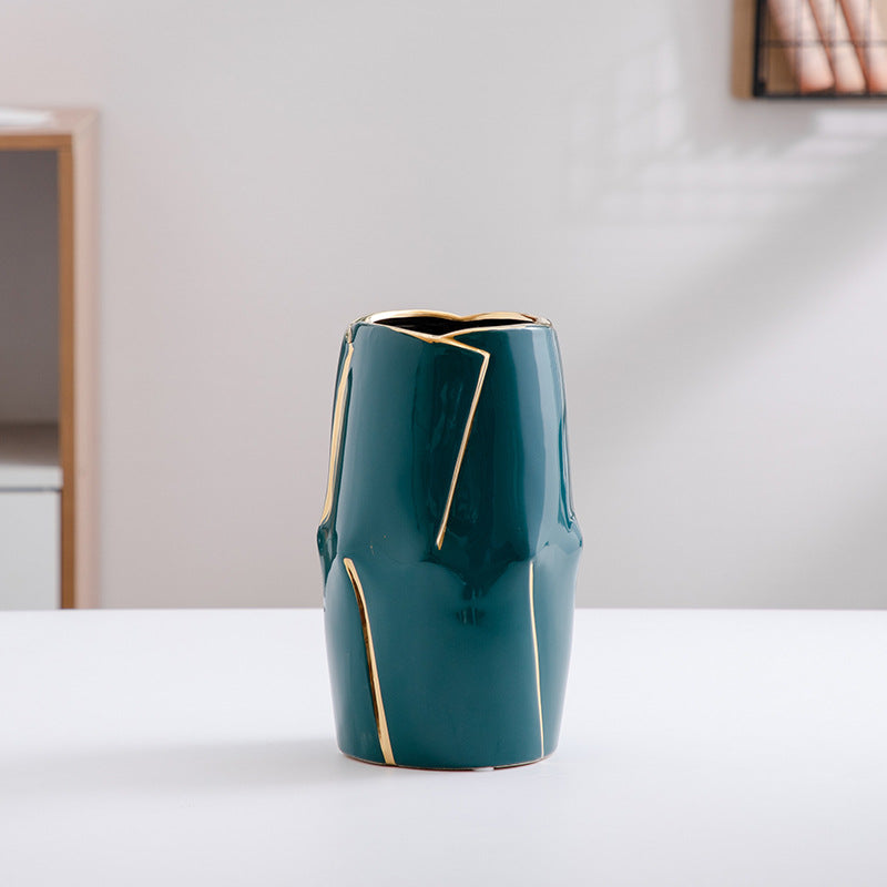 Decorative ceramic vase with golden accents