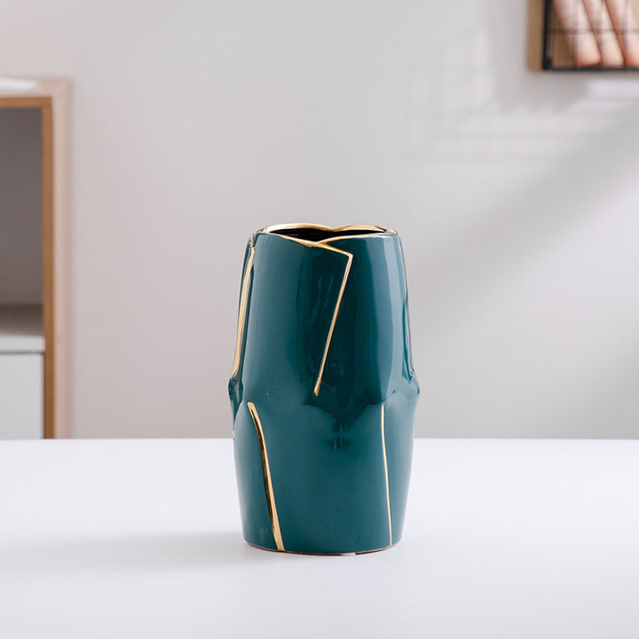 Decorative ceramic vase with golden accents