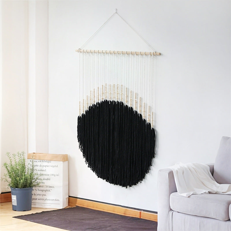 Decorative wall art with wooden beads and thread pendulum