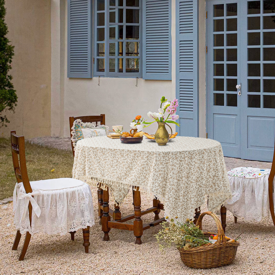 Rectangular tablecloth made of cotton-linen blend with delicate floral print and tassels