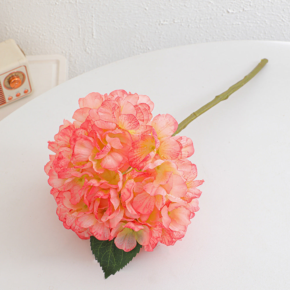 Artificial flower branch with realistic flowers