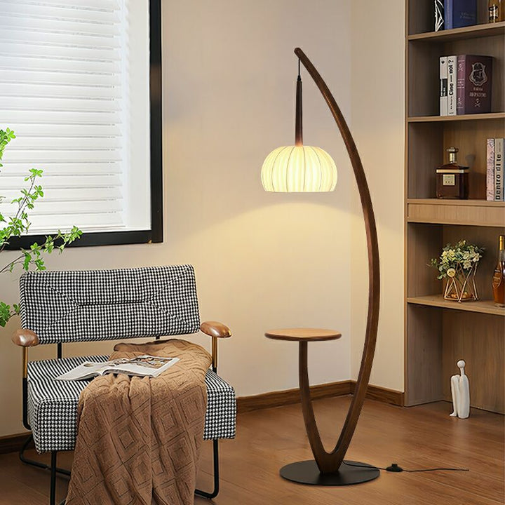 Artistic curved floor lamp with integrated side table