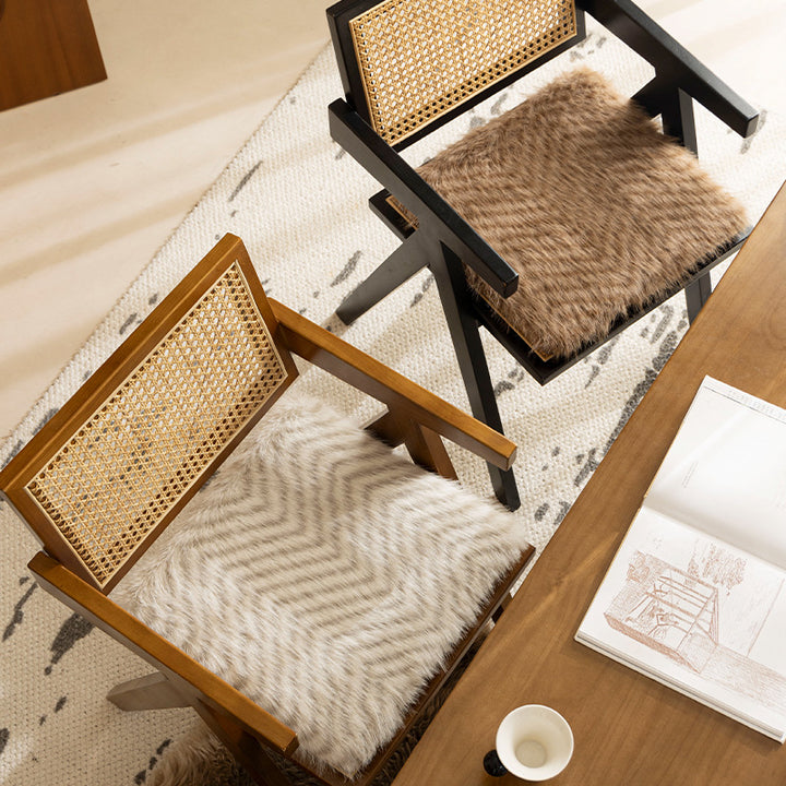 Square chair cushion made of cozy artificial fur with non-slip base and strap attachment