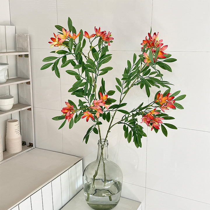 Decorative artificial flower branch with delicate flowers