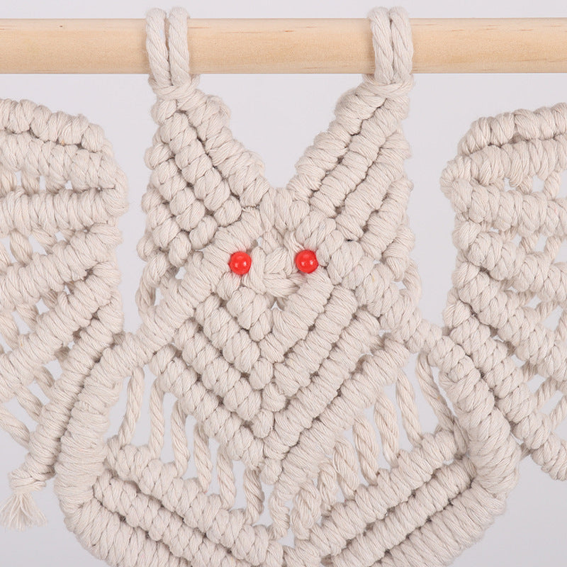 Macrame plant hanger with decorative design
