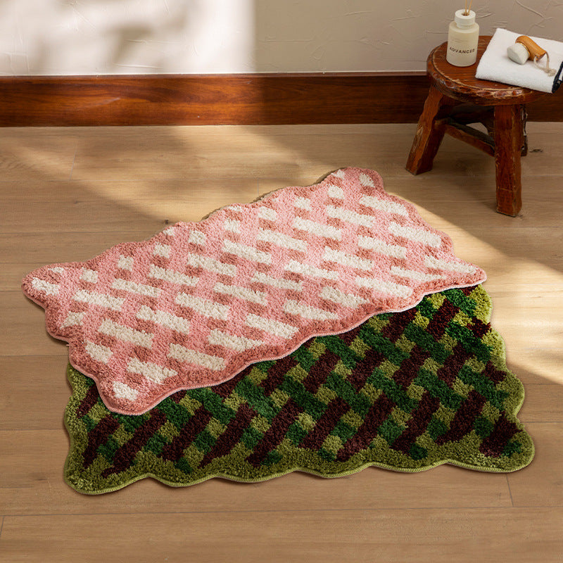 Tufted bathroom runner with wavy hem and relief-style braided pattern