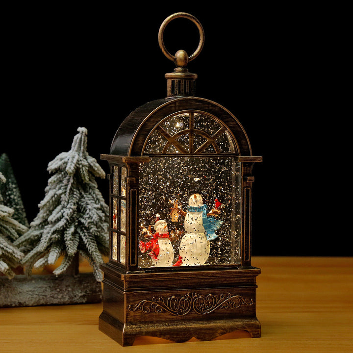 Nostalgic Christmas lantern with snowfall and moving Santa Claus scene