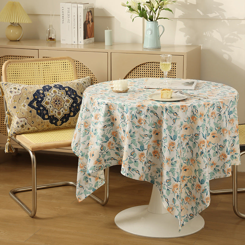 Wipeable tablecloth made of polyester with floral watercolor look and water-repellent coating