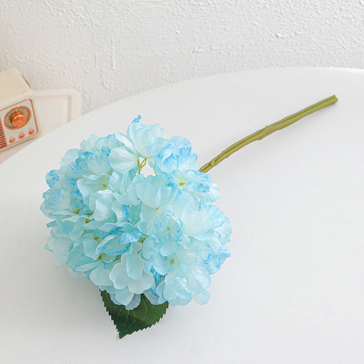 Artificial flower branch with realistic flowers