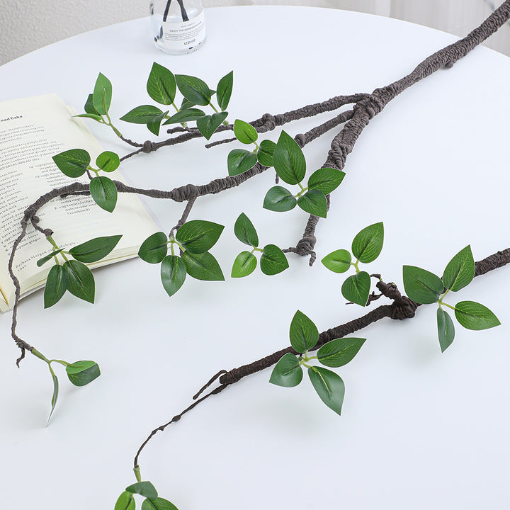Decorative artificial tree branch with realistic leaves