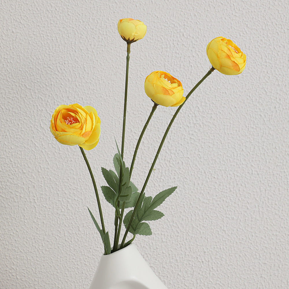 Decorative artificial flower bouquet with intricately detailed ranunculus