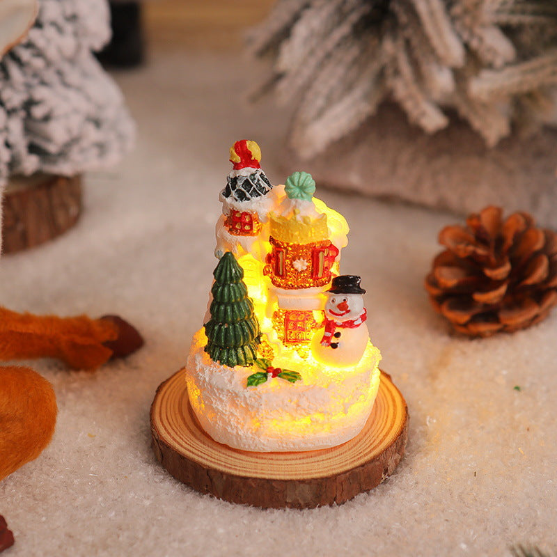 Christmas miniature lighting with snow scenes