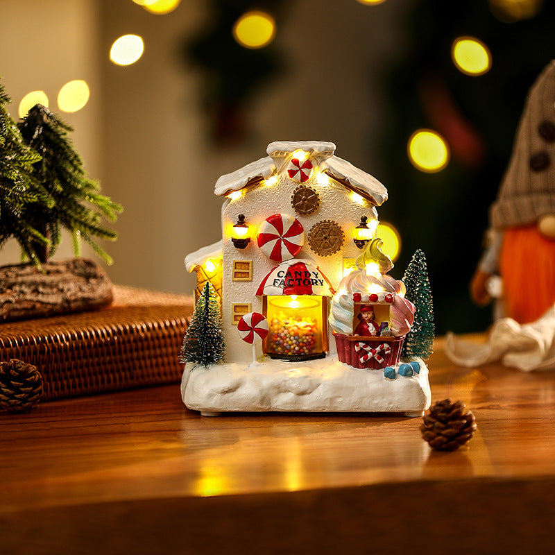 Illuminated Christmas village decoration with moving figures