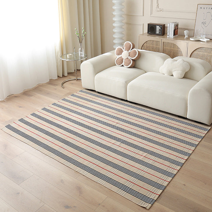 Woven living area rug with large check pattern and flat cotton texture