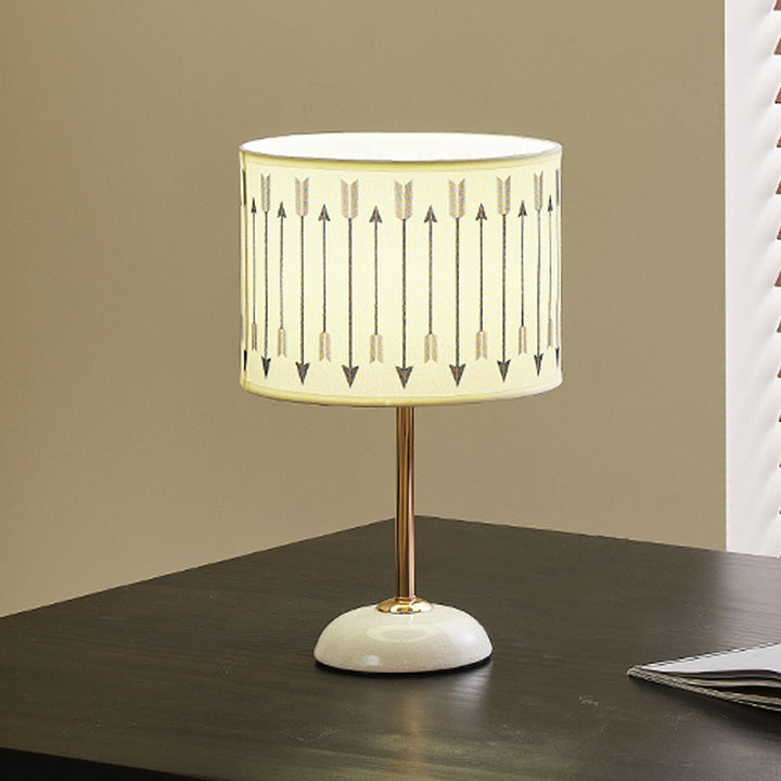 Ceramic base bedside lamp with fabric shade in arrow pattern