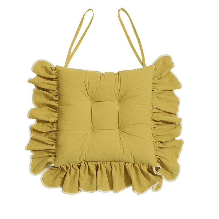 Padded chair cushion with ruffle and ties
