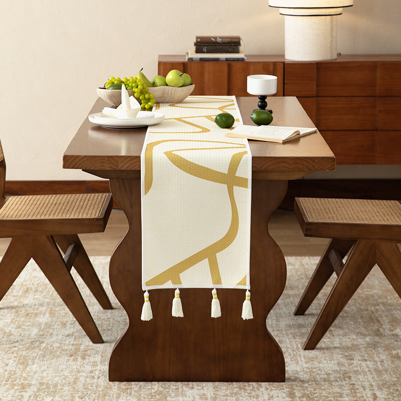Light waffle texture throw blanket with geometric print and tassels