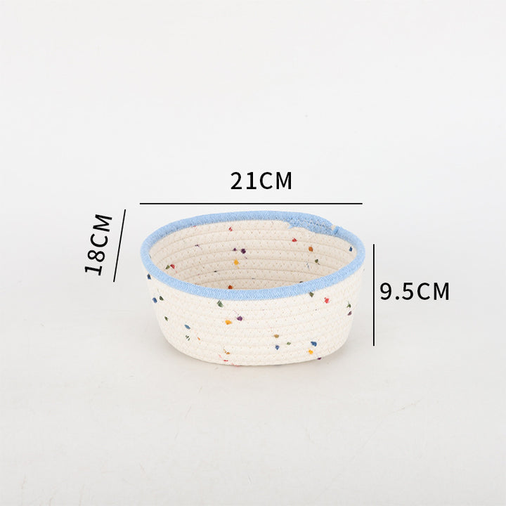 Storage basket made of natural cotton fabric with colorful dots