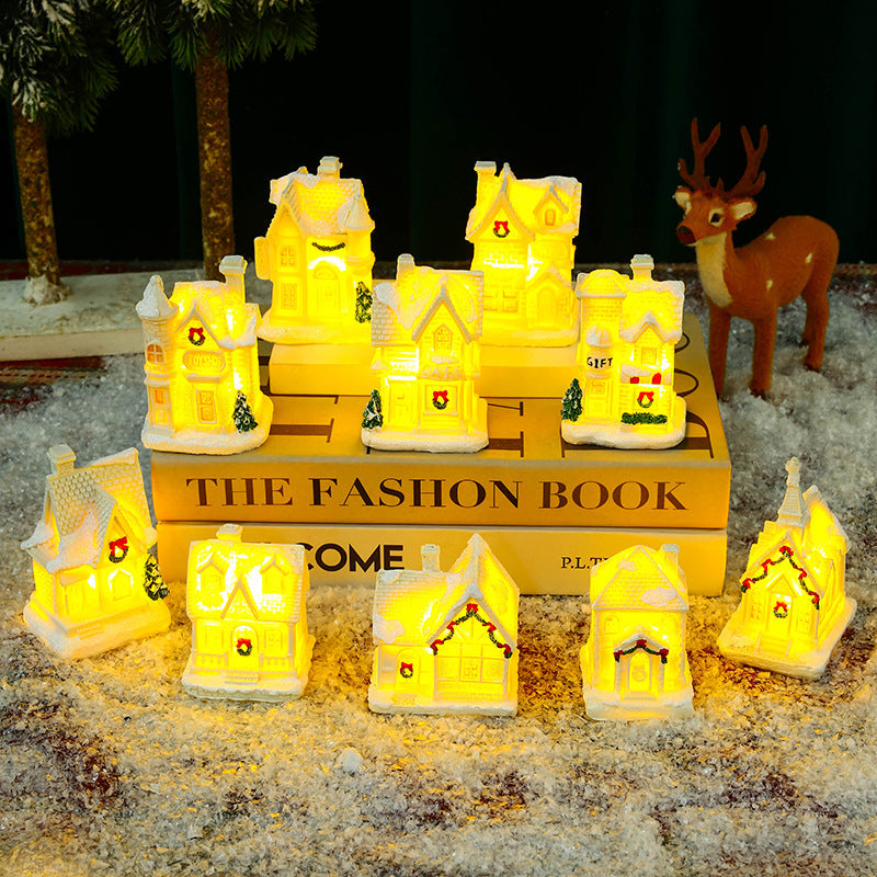 Illuminated Christmas village house with festive decoration