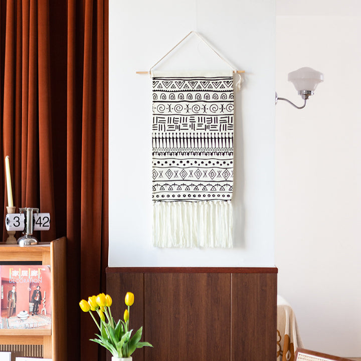 Woven cotton blend wall hanging with graphic ethnic pattern and long fringes
