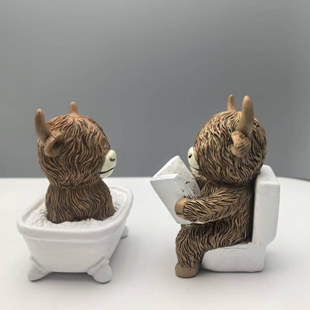 Funny decorative figure of a Highland cow in a bathtub