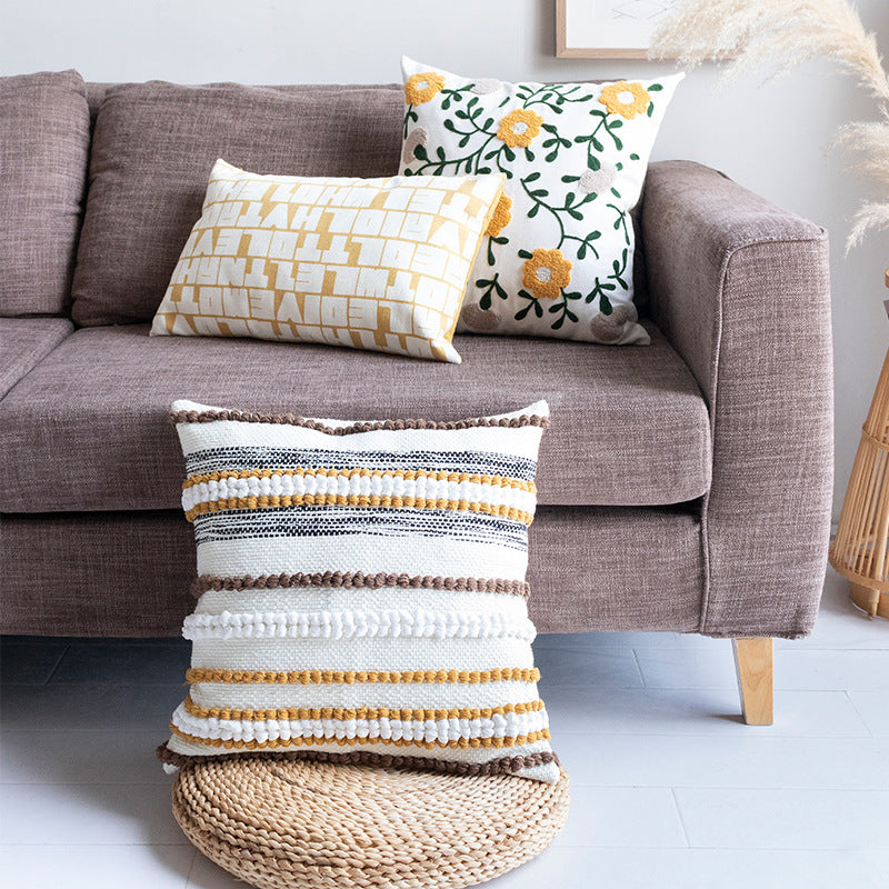Embroidered square cushion cover made of cotton-linen with tufted flower appliqué