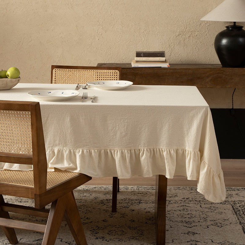 Rectangular decorative tablecloth with gathered flounce and light linen look